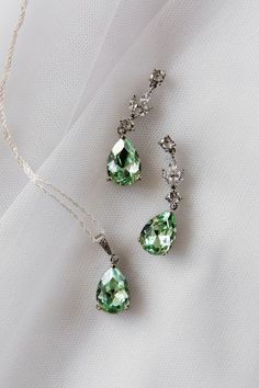 An absolutely stunning sage green / peridot colour teardrop jewellery set.  Simulated diamonds.  Standard 18 inch chain - other lengths available ie 16, 20 inch or add a 2 inch extension- please just add details to order notes otherwise standard 18 inch will be sent.  Earring length approx 1.5 inch.  Silver plated lead and nickel free. ( sterling silver chain )  Beautifully gift boxed Green Bridal Jewellery Set, Green Bridal Jewellery, Earring Pendant Set, Bridal Jewellery Set, Silver Earrings Wedding, Bridal Jewellery Inspiration, Teardrop Jewelry, Formal Jewelry, Wedding Earrings Drop