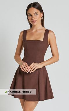 Get ready to turn heads in the Adiana Mini Dress! This linen look square neck dress in chocolate is perfect for those casual days out or fun festival adventures. The shirred back and A-line silhouette create a flattering fit, while the sleeveless design keeps you cool and comfortable all day long. Made from a blend of linen and cotton, this dress not only looks amazing but feels great too. With its versatile style and earthy brown color, it's easy to see why the Adiana Mini Dress is a must-have addition to your wardrobe. Product Details: Zips detail Shift, Day Dress Linen, Cotton fabric Square neckline Casual, Festival wear Mini length Sleeveless design Size and Fit Size S / 8 length: 80cm / 31.5in Material and Care 70% Cotton, 30% Linen No Stretch Natural Fibres The main fabric of this pr Brown Square Neck Mini Dress For Brunch, Brown Square Neck Mini Dress For Fall, Fitted Brown Mini Dress With Square Neck, Fitted Brown Cotton Mini Dress, Casual Brown A-line Mini Dress, Square Neck Dress, Linen Dresses, Fabric Squares, Festival Wear