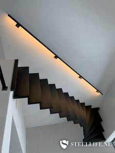 an image of a staircase going up to the ceiling