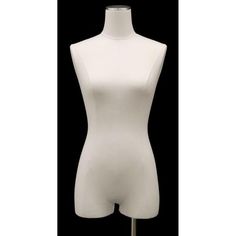 a white female mannequin on a black background