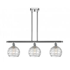 three light pendant fixture with glass globes on the bottom and two lights above it