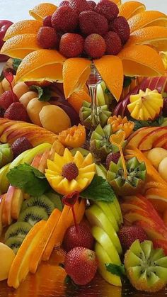 a bunch of fruit is arranged on a table