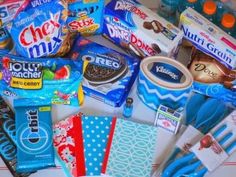 an assortment of snacks and candy on a table