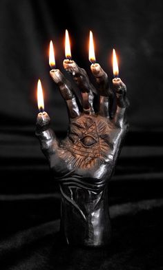 a hand that has five candles in it