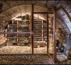 an old wine cellar with many bottles in it