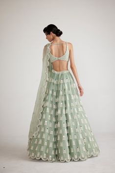 Powder mint green chandelier pearl lehenga clubbed with an intricately hand-embroidered blouse and dupatta.From Vvani Vats Piroi's collection.DELIVERY TIMEPlease allow 8-12 weeks for your outfit to arrive.FABRIC DETAILSOrganza, GeorgetteProfessional cleaning only. Pearl Lehenga, Mint Green Lehenga, Green Chandelier, Vani Vats, Green Chandeliers, Hand Embroidered Blouse, Bridesmaid Lehenga, Lehenga Dupatta, Cutout Blouse