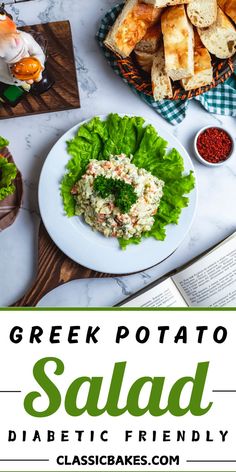 a white plate topped with salad next to a book and other foods on a table