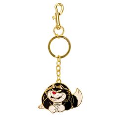 an anime character key chain with a black and white cat on it