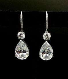 "𝐃𝐞𝐬𝐜𝐫𝐢𝐩𝐭𝐢𝐨𝐧 : *Pear With Round Moissanite Diamond Dangle earring, Leverback Earring For Women, Dangle & Drop Earring, 925 Sterling Silver Teardrop Earring. Let's Design Your Jewelry with Moissanite. Moissanite is a gemstone that looks a lot like a diamond. It possesses fire, brilliance, and lustre more than that of a diamond. It is not a fake diamond. ❖ 𝐃𝐢𝐚𝐦𝐨𝐧𝐝 𝐃𝐞𝐭𝐚𝐢𝐥𝐬 *Color : White *Clarity : VVS *Cut : Excellent *Shape : Pear *Stone Size : 1.50, 5.80, 14*10 MM *Total Luxury Brilliant Cut Teardrop Earrings, Luxury Classic Diamond White Teardrop Earrings, Luxury Classic Brilliant Cut Teardrop Earrings, Luxury Classic Teardrop Earrings With Brilliant Cut, Luxury Teardrop Brilliant Cut Earrings, Luxury Sterling Silver Teardrop Diamond Necklace, Luxury Silver Teardrop Earrings With Brilliant Cut, Luxury Brilliant Cut Teardrop Earrings For Formal Occasions, Luxury Classic Silver Teardrop Earrings