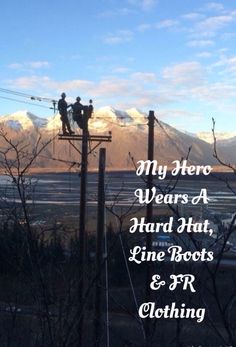 two people standing on top of power lines with mountains in the background and text that reads, my hero wears a hard hat, line boots & r clothing