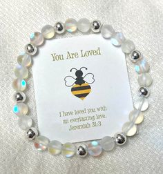 "A beautiful 6mm Quartz Crystal (mermaid glass) and sterling silver  6mm ball beads. This bracelet was created to remind us that we are LOVED by the Creator of the Universe, God. The enclosure card is inscribed with the scriptures: \"I have loved you with an everlasting love.\" Jeremiah 31:3 and Psalm 139:14 \"You are beautiful. For you are fearfully and wonderfully made.\"" Crystal Mermaid, Universe God, Affirmation Bracelets, Jeremiah 31, Creator Of The Universe, Hot Springs National Park, Mermaid Glass, Fearfully And Wonderfully Made, Psalm 139