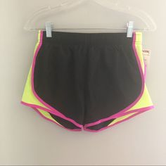 Make Me An Offer! Condition: Nwt Size: Small Lined Running Shorts Elastic Waistband Pink Trim With Neon Yellow Mesh Side Detail Sporty Neon Stretch Bottoms, Neon Sports Bottoms, Sporty Stretch Color Block Shorts, Sporty Color Block Athletic Shorts, Sporty Neon Bottoms For Sports, Sporty Black Color Block Shorts, Spring Running Black Bottoms, Pink Stretch Athletic Shorts For Running, Pink Trim