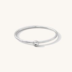 Minimal and sweet, the Tiny Solitaire Ring is ideal for every day. It adds the perfect hint of sparkle and confidence to any occasion. Wear it for your next weekend brunch or girls' night out. It's even comfortable enough to leave on for your favorite yoga class! DETAILS 14k gold filled -or- sterling silver ring 1mm band with 2mm cubic zirconia Available in sizes 5-10 Safe for sensitive skin & shower safe Matching jewelry: Tiny Solitaire Necklace, Solitaire Necklace, Solitaire Ring, Tiny Solita Solitaire Bands, Dainty Initial Necklace, Multiple Rings, Solitaire Necklace, Gold Solitaire Ring, Ball Chain Necklace, Solitaire Necklaces, Detailed Ring, Gold Filled Ring