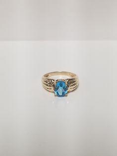 Thanks for shopping our vintage estate store. We tend to sell well below wholesale and truly hope you enjoy all of our items. Many of the items are one of a kind, so please enjoy scrolling through the pictures and hopefully something will catch your eye. Spots and reflections are from camera. Estate 10k yellow gold blue aquamarine 3ct oval stone ring. Gem is testing natural aquamarine, might be created. Ring size: 9 Setting: 1/4" 7mm by 3/8" 9mm Band width: 2mm Weight: 2.70 grams Stone: 3ct Beautiful ring, marked 10k. Vintage ring from the 70's or 80's. Vintage Yellow Gold Rings With Blue Topaz, Vintage Yellow Gold Blue Topaz Rings, Vintage Blue Gemstone Birthstone Ring, Vintage Blue Topaz Ring In 14k Gold, Classic Blue Topaz Ring, Classic Hallmarked Topaz Ring For Collectors, Classic Hallmarked Topaz Ring For Collectible, Classic Collectible Hallmarked Topaz Ring, Vintage Blue Ring Stamped 14k