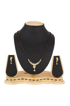 Fashion Jewellery American Diamonds MangalsutraProduct Features :  Color: White and Gold Material: Alloy Mangalsutra Set, Mangal Sutra, Silver Fabric, Stone Studs, American Diamond, Luxor, Gold Material, Fashion Jewellery, Gold And Silver