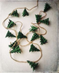 small green christmas trees tied together with twine