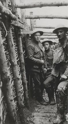 an old black and white photo of men in uniforms