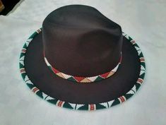 This is a spectacular black unisex high quality fedora hat that is hand beaded on the BRIM .The beading is so unique and makes one to stand out in a crowd. The hat is a perfect accessory for parties ,weddings,trips and vacations Head circumference can fit a size: 57/58cm EXPRESS SHIPPING VIA DHL. Beaded Hat Brim, Beaded Hats, Fedora Fashion, Hats Fedora, Beaded Hat, Zulu, Fedora Hat, Summer Hats, Head Circumference