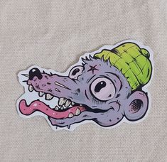 a sticker depicting an alligator with a hat on it's head and teeth