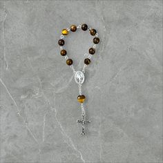 Embrace the serenity of prayer wherever you go with our exquisite Single Decade Pocket Rosary. Meticulously handcrafted with care and devotion. 🌟 Features: - Authentic craftsmanship: Handmade with love and precision. - Compact design: Fits snugly into your pocket, purse, or backpack for easy carrying. - Quality materials: Crafted using high-quality beads. - Elegant aesthetics: Delicately designed to inspire peace and tranquility during prayer. 🙏 Purpose: Designed for those seeking solace in th Round Polished Bead Rosary As Gift, Polished Round Beads Rosary As Gift, Adjustable Spiritual Rosary With Spacer Beads, Adjustable Rosary With Polished Beads For Meditation, Adjustable Polished Beads Rosary For Meditation, Spiritual Rosary Bracelet With Polished Beads, Adjustable 8mm Beads Rosary For Healing, Gemstone Beads Rosary As Gift, Spiritual Rosary With Spacer Beads