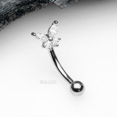 Our Butterfly Glam Prong Set Sparkle Curved Barbell is crafted with luxury in mind. Shimmering curved barbell provides the perfect touch of glamour to any look while fitting a range of piercings, from cartilage and daith to bridge, lips, and lobes. * Material: 316L Stainless Steel * Size: 16 GA (1.2mm), 8mm (5/16") * Butterfly measures 5.5mm * Bottom ball measures 3mm Suitable for * Ear Piercings (Cartilage, Daith, Rook, Snug) * Facial Piercings (Bridge, Eyebrow, Third Eye) * Lip Piercings (Dahl Vertical Labret, Piercings Cartilage, Lip Piercings, Heavy Sweating, Ear Piercings Cartilage, Bottom Lip, Facial Piercings, Snake Bites, Lip Piercing