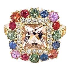 4.05 Carat Morganite Sapphire Diamond Yellow Gold Cocktail Ring  Item Specs:  Morganite (Princess Cut) = 1.71 carats 24 Multi-Color Sapphires (Round Cut) = 2.04 carats 20 Round Cut Diamonds = 0.30 carats (Clarity: SI1, Color: F) 14K Yellow Gold = 5.6 grams Total Carat Weight = 4.05 carats Ring Size = 7 (complimentary ring sizing available)  Exact dimensions for this item are unknown. Please reach out in the seller Q&A for any questions on measurements. Luxury Multicolor Sapphire Ring For Formal Occasions, Luxury Multi-stone Cubic Zirconia Gemstones, Formal Multicolor Diamond Gemstones, Multicolor Brilliant Cut Sapphire Ring For Formal Occasions, Elegant Multicolor Brilliant Cut Sapphire Ring, Elegant Multicolor Brilliant Cut Gemstones, Luxury Multi-stone Cubic Zirconia Cluster Ring, Multicolor Sapphire Ring With Prong Setting For Formal Occasions, Luxury Cushion Cut Multi-stone Jewelry