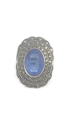 "Art Deco Vintage Blue Glass Stone & Marcasites Sterling Silver Ring Size 3.25 Weight 6.7g Length 1 1/16\" Width 3/4\" Rings are delivered in a Gift Box Free Domestic USA Shipping & Free Postal Insurance If you do not want the ring polished and want to leave the natural patina please let me know at the time of purchase as I do polish rings before I ship rings out. Thanks USPS Domestic Shipping is free for buyers. If a buyer prefers to upgrade to priority, the buyer will pay that portion Adjustable Blue Rings With Accent Stones, Antique Blue Rings With Center Stone, Blue Gemstone Cluster Ring Vintage Style, Vintage Blue Gemstone Cluster Ring, Antique Blue Gemstone Rings, Blue Oval Sapphire Ring With Stone Setting, Vintage Blue Rings With Stone Setting, Vintage Blue Oval Ring, Collectible Blue Gemstone Ring