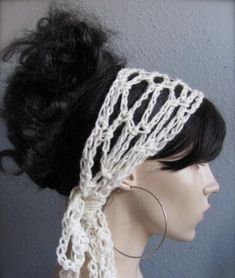 a mannequin headpiece with white crochet on it's side