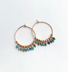 Summery turquoise and gold hoops. Great bohemian vibe for long summer days. + Turquoise. 14K Gold Fill Hoops. 14K Gold Plate Beads. + Length: 1.5 inches. + Earrings are ready to ship. + Your jewelry will come in a jewelry box, tied with a ribbon. ➤➤ Have a question about this product, reach out to me here ➙ https://www.etsy.com/conversations/new?with_id=9057464&referring_id=5772224&referring_type=shop&recipient_id=9057464 ➤➤ Check out our other earrings: http://www.etsy.com/shop/laurastark?secti Coin Pearl Earrings, Turquoise Hoops, Pearl Earrings Wedding, Turquoise And Gold, Gold Filled Hoops, Crystal Jewellery, Coin Pearls, Summer Earring, Earrings Boho