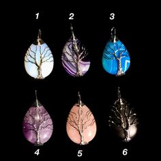 Wire wrapped tree crystal pendantEach stone is unique in their own way. Choices include:Opalite (1)Purple Banded Agate (2)Blue Banded Agate (3)Amythest (4)Rose quartz (5)Obisidian (6)Each pendant includes a 18" black cloth chain Size: 1 1/2 inch Wire Wrapped Crystal Necklace, Wrapped Crystal Necklace, Wire Wrapped Tree, Wire Wrapped Crystal, Wrapped Crystal, Wire Wrapping Crystals, Purple Band, Banded Agate, Blue Band