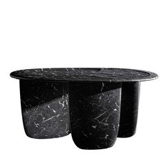 two black marble tables sitting next to each other