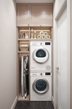 a washer and dryer in a small room next to a closet with shelves