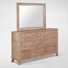 a wooden dresser with a large mirror on it's top and bottom drawers below