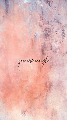 the words you are enough written in cursive writing on a pink and blue wall