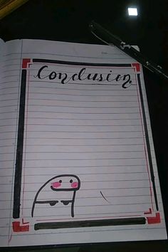 an open notebook with writing on it that says complusing next to a pen