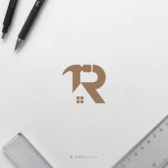 the letter r is placed on top of a paper with a ruler next to it