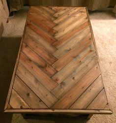 a coffee table made out of wooden planks