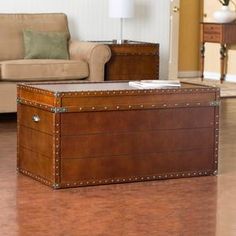 a large trunk sitting on top of a hard wood floor