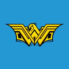 the logo for wonder woman, which is yellow and black with an eagle on it