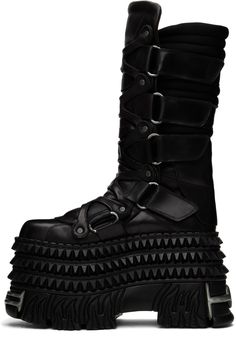 Calf-high buffed leather boots in black. · Graphic rivets throughout · Graphic hardware at toe, heel, and sole · Cinch velcro closure at sides · Padded tongue · Quilted jersey collar · Buffed leather lining · Studded platform rubber midsole · Treaded rubber sole · Platform: H4.5 · Heel: H5 Part of the VETEMENTS X New Rock collaboration. Supplier color: Black Rock Style Leather Platform Boots, High-top Leather Platform Boots With Rivets, Leather Platform Boots With Studded Outsoles For Concert, Fitted Black Gothic Moto Boots, Alternative Leather Boots With Studs, Leather Platform Boots With Studded Outsoles For Streetwear, Leather Boots With Spikes For Streetwear, Spiked Leather Boots For Streetwear, Leather Studded Boots For Alternative Fashion