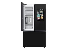 a black refrigerator freezer with the door open and pictures on it's side