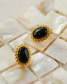 Introducing our Black Onyx White Shell Earrings, a stunning fusion of elegance and contrast perfect for elevating your accessory game. Versatile design, contrasting colors, and exquisite beauty make these earrings a must-have in your collection. Metal:18ct Recycled Gold Plated Vermeil on Recycled Sterling Silver Gemstone: Black Onyx,Mother of Pearls Earrings Dimensions: 17mm Weight: 3.5g Elegant Black Earrings For Formal Occasions, Elegant Black Formal Earrings, Elegant Black Enamel Earrings For Formal Occasion, Onyx Earrings For Evening, Elegant Black Enamel Earrings For Gift, Chic Oval Earrings For Formal Occasions, Black Oval Earrings For Formal Occasions, Elegant Onyx Jewelry With Tarnish Resistance, Classic Onyx Earrings For Evening