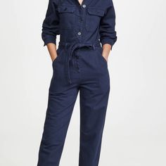 Navy Blue Button Front Boilersuit Style Jumpsuit, Tie Waist Fabric: Non-Stretch Denim Collared Neck And Button At Placket Long Sleeves With Button Cuffs Detachable Belt Slant Hip Pockets, Flap Breast Pockets And One Patch Back Pocket Ankle Length Shell: 100% Cotton Wash Cold Imported, Turkey Style #Refor40127 A Relaxed Reformation Jumpsuit Modeled On Classic Workwear And Crafted From Sturdy Cotton. Heels, Sandals, And Sneakers All Work Equally Well With This One-And-Done Silhouette. Blue Buttoned Denim Jumpsuit For Work, Blue Denim Jumpsuit With Buttons For Work, Chic Denim Jumpsuit For Work With Buttons, Denim Overall Jumpsuit With Button Closure For Work, Denim Jumpsuit With Button Closure For Work, Workwear Denim Overall Jumpsuit With Button Closure, Blue Jumpsuits And Rompers For Work With Button Closure, Fall Blue Jumpsuits And Rompers For Workwear, Blue Jumpsuit With Button Closure For Work