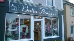 a store front with the words balla florists on it's side