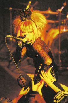 an image of a woman with blonde hair on stage