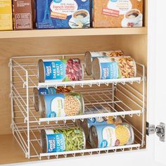 an organized pantry with canned food and cereals