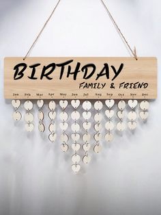 a wooden sign that says birthday family and friends