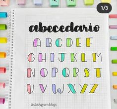 a notebook with the alphabet written in different colors