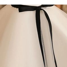 Make your little girl feel like royalty with the Elegant Black and White Princess Dress—a stunning combination of classic elegance and modern design, perfect for formal events, parties, and special occasions. Our Elegant Black and White Princess Dress features a vintage-inspired design with a beautiful bowknot accent. This sleeveless gown is crafted from high-quality materials, ensuring both comfort and style for your little princess. The dress’s bold black and white contrast adds a timeless charm, while the flowing ball gown silhouette creates a graceful and sophisticated look. Whether for a formal event, a birthday party, or a boutique celebration, this dress is the perfect choice for making a statement. Imagine your child stepping into a room in this exquisite princess dress, radiating Elegant Prom Dresses With Sashes, Elegant Tulle First Communion Dress, Elegant Ball Gown For First Communion Party, Elegant Ball Gown Princess Dress For Formal Occasions, Elegant Formal Princess Ball Gown Dress, Elegant Fitted Princess Wedding Dress, Tulle First Communion Dress With Satin Bow, Elegant Black Princess Dress For Dress-up, Elegant Fitted Princess Dress Ball Gown