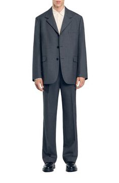 Oversized suit jacket with long sleeves, button fastening and flap pockets. Sandro Men's suit jacket Oversized fit Long sleeves Button fastening 2 flap pockets Slanted chest pocket The model is 6'1 tall and wears a size 48 Tailored Suits With Pockets For Office Wear, Business Casual Long Sleeve Suits With Welt Pockets, Professional Suits With Pockets For Formal Occasions, Professional Formal Suits With Pockets, Professional Single-breasted Outerwear For Business Meetings, Professional Fall Suits With Pockets, Fall Professional Suits With Pockets, Professional Long Sleeve Suits With Pockets, Professional Long Sleeve Suits With Welt Pockets